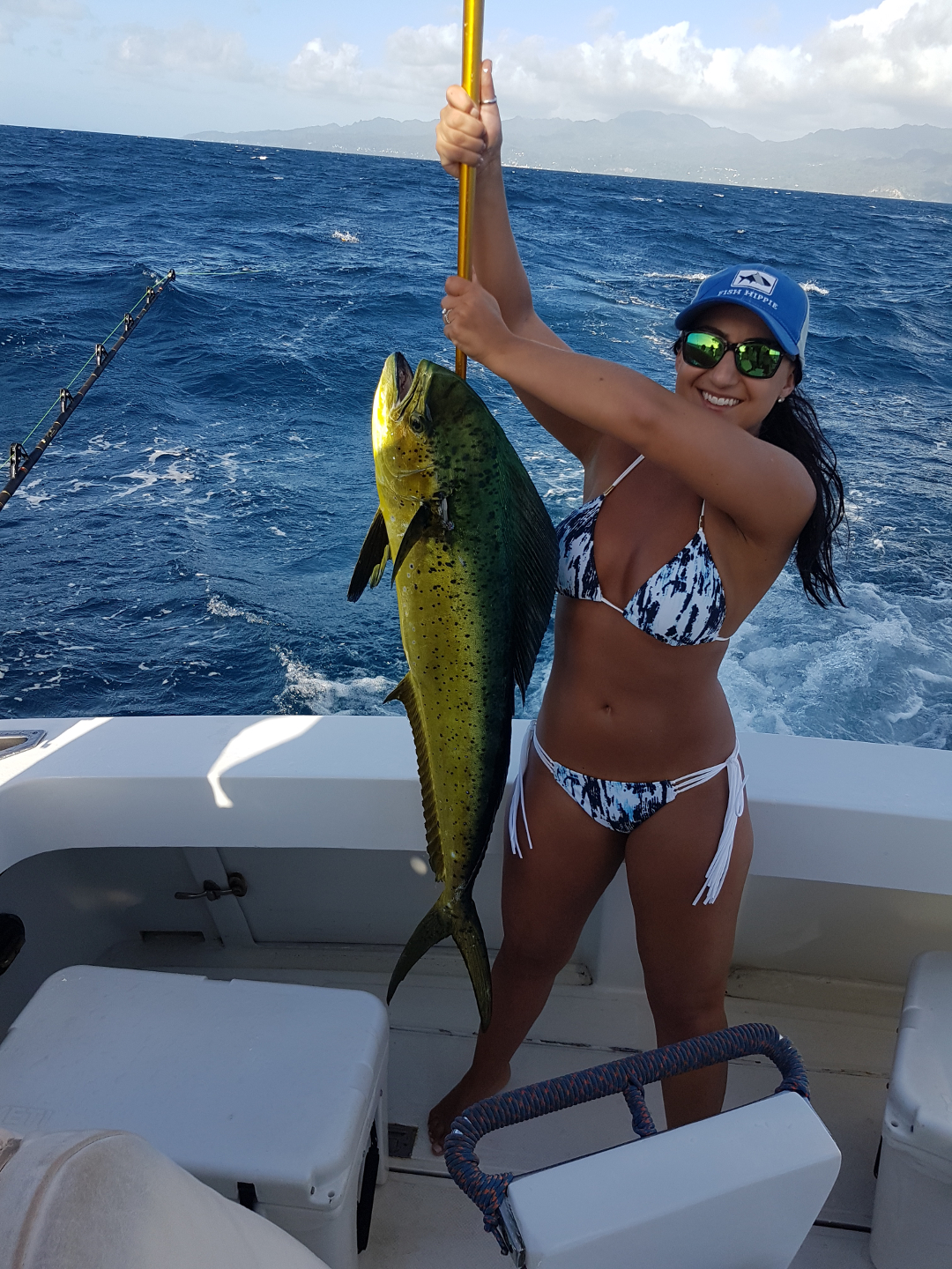 lady lifts her dorado