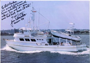 El Zorro at sea with a smaller boat on the back