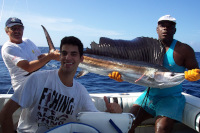 Alex in front of his silfish held by Gary & Leslie in the boat before release