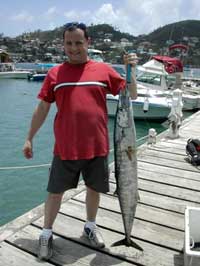 22lb wahoo and angler at GYC