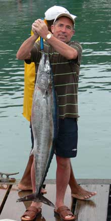 clients holds up his wahoo