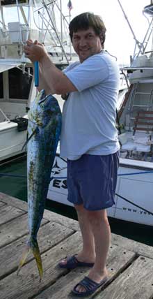 angler holds the dorado they caught on yes aye