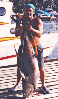 118 lb tuna held up by Chris
