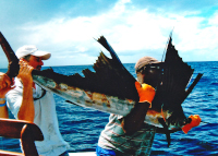 Gary & Leslie hold up Mr Jackson's sailfish
