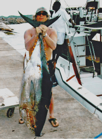 Badger with his big eye tuna at fishmarket dock
