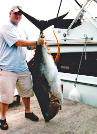 Mr Emmett with his 165lb yellowfin tuna at GYC dock