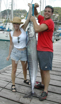 Richard Holt & wife hold previous boat record wahoo 61lb