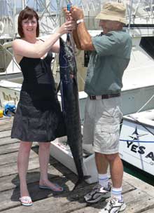 lady needs help to hold up her wahoo
